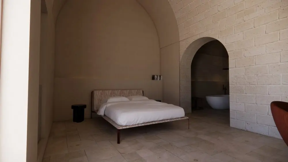 Camera con volta a botte in pietra e arco verso il bagno, Palazzo Cerere, Polignano a Mare